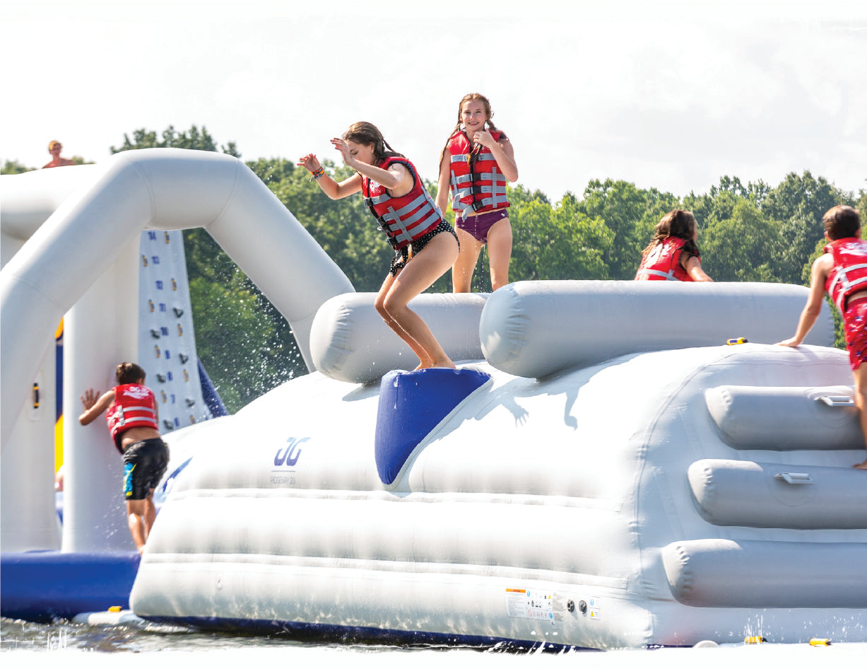 Kids playing on an aquaglide component