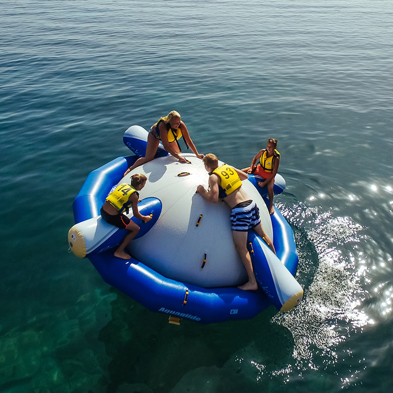 Four people in life vests enjoy the Rockit on the ocean.