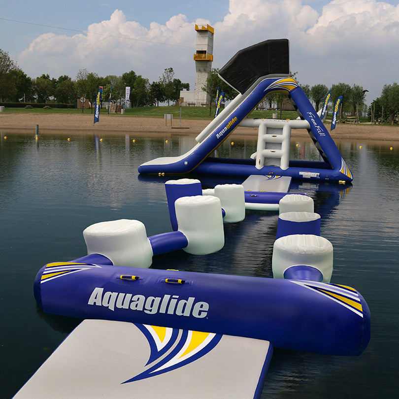 I-Hop 20: Non-slip inflatable water course with slide for balance testing on a lake.