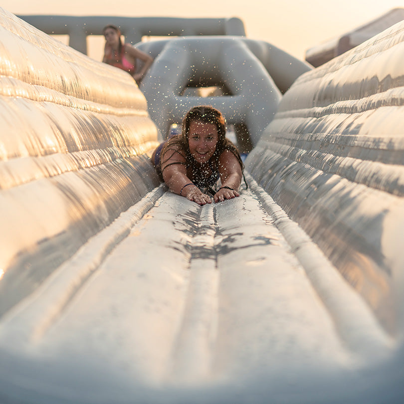 Sliding down the Lugeway 10, splashing water and enjoying every moment.