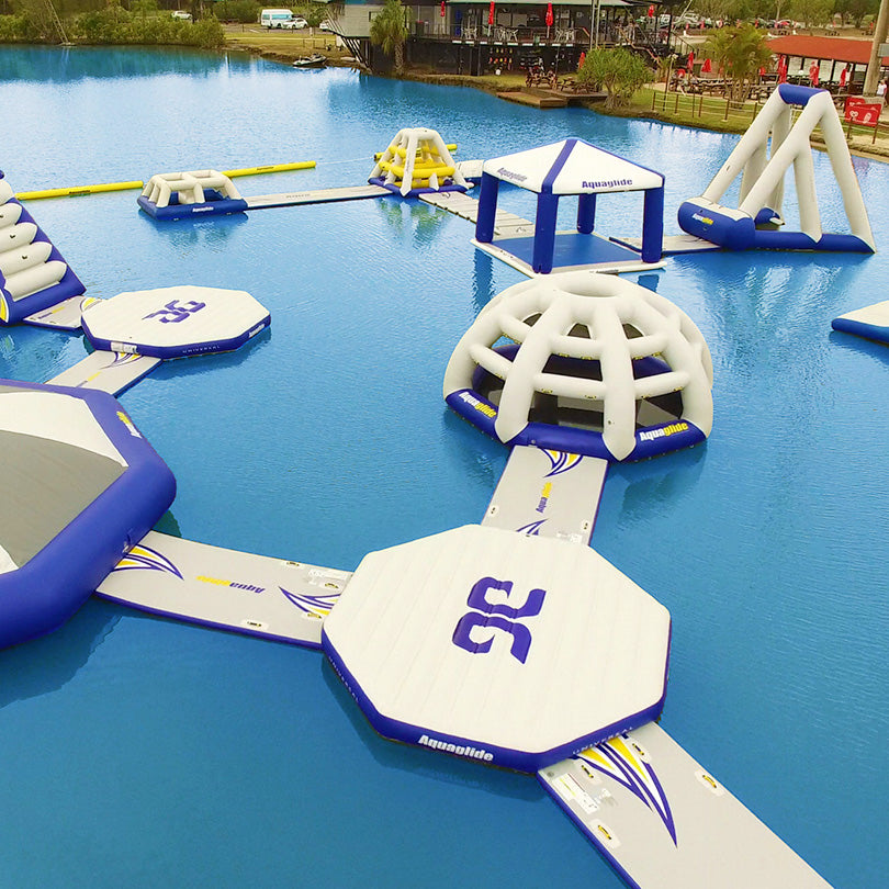 Aquapark with slides, platforms, and a dome featuring Aquaglides Universal Connection.
