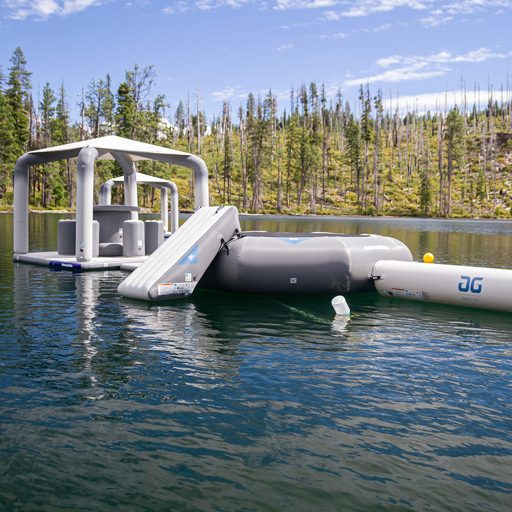 Lakefront Mini Park 1 floats on a lake, surrounded by pine woods.