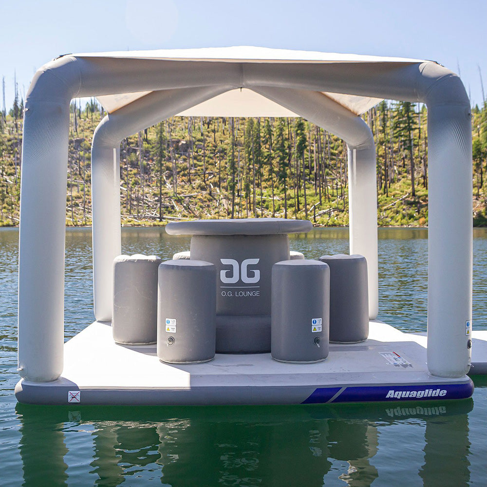 OG Lounge with canopy floats serenely on a calm lake.