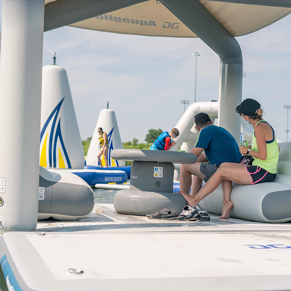 The Ohana Lounge is a popular spot near water play structures on sunny days.