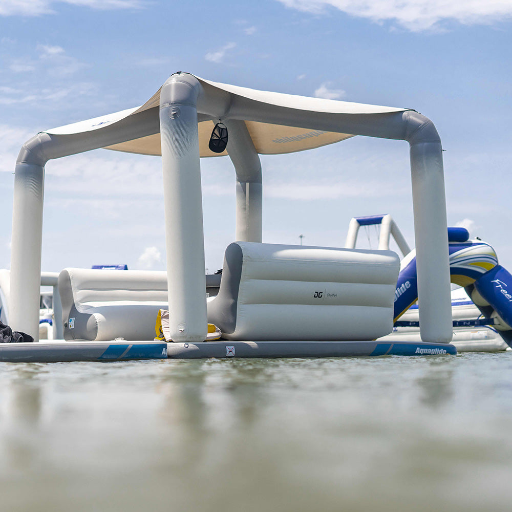 Ohana Lounge: Enjoy a social lounge with inflatable cabana and loungers under the blue sky.