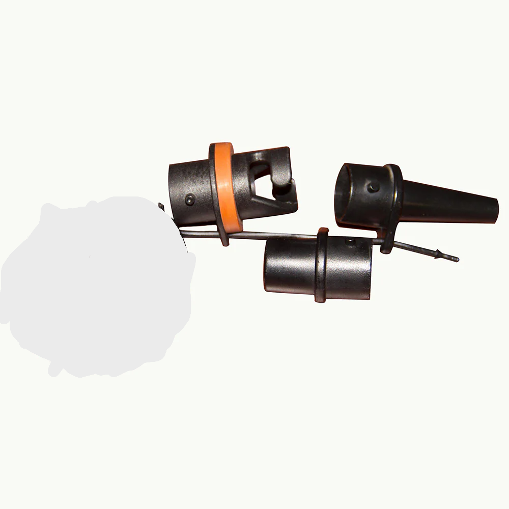 Angled view of 3 piece adapter set with black plastic nozzles and orange ring.