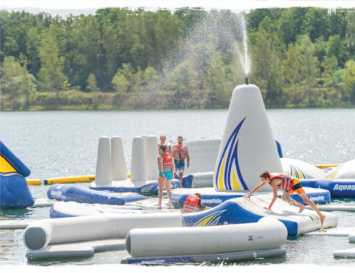 People standing on an Aquaglide inflatable structure