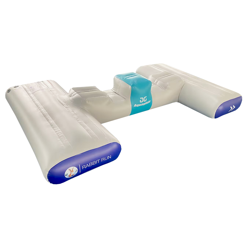 Rabbit Run inflatable water obstacle with teal center and blue ends on a white base.