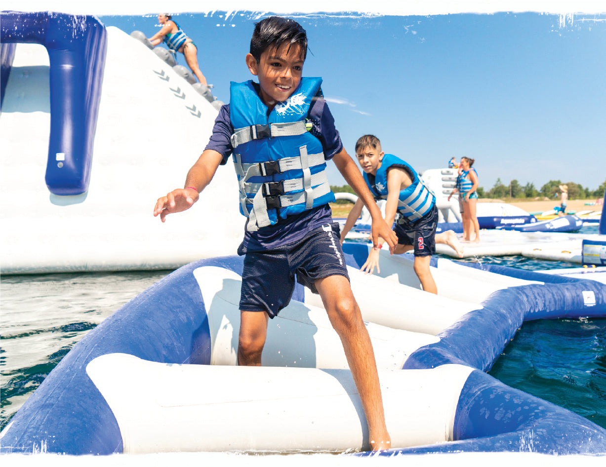Boys climbing through an Aqualide product