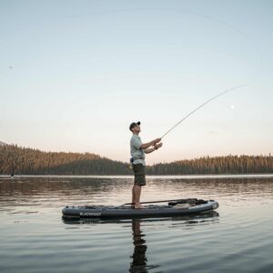 Man casts a fly from the Blackfoot SUP during sunrise